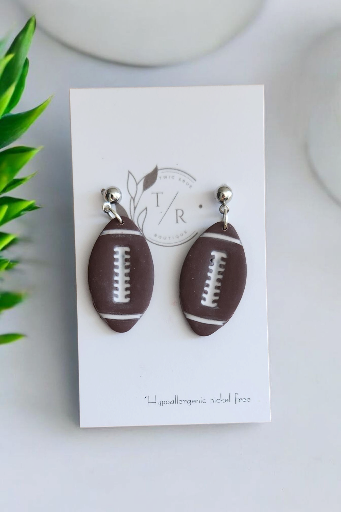 Football dangle earrings